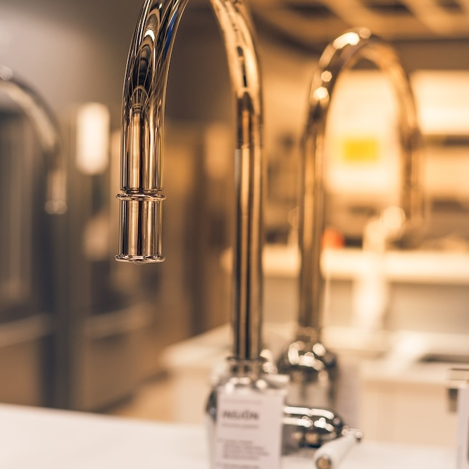 Faucet with warm atmospheric background.
